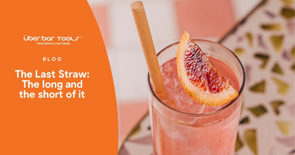a delicious cocktail with fruit topping and an eco straw
